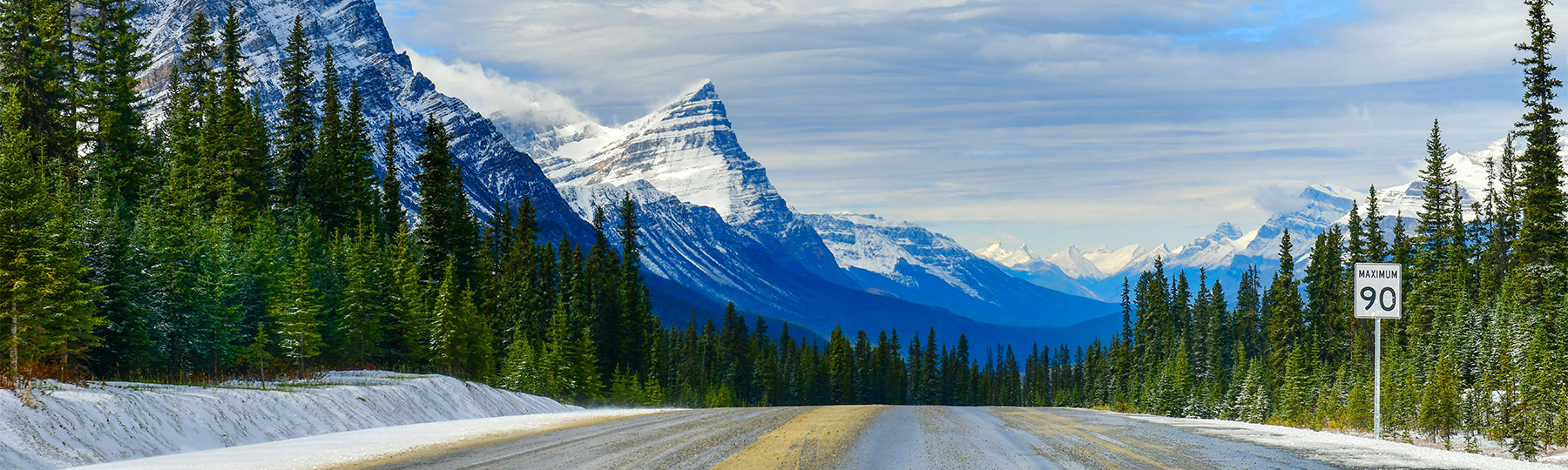 Photo of a Canadian Highway with a mountain backdrop